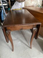 Full table with leaves folded down showing legs and brackets