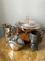 Group shot showing all five silver-plated pieces