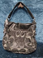 Front view of Coach Zoe optic signature hobo handbag