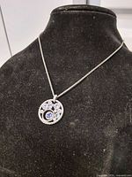 Pendant necklace on display bust