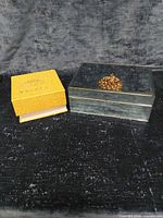 Closed presentation box and mirrored jewelry box side by side