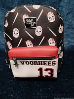 Front view showing print, logo patch, Voorhees 13 pocket, zippers