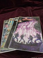 Stack of three comics showing Ghostbusters Mass Hysteria! on top