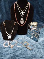 Group shot displaying jewelry box, necklaces, bracelets and wristwatch