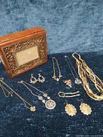 Full view of jewelry box and assorted jewelry laid out