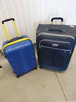 Both suitcases side by side for size and style comparison