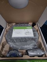 Vacuum and accessories sealed inside box