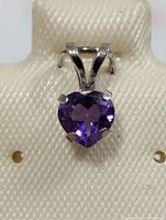 Front view showing heart-shaped amethyst and prong setting