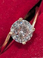 Front view of ring showing round brilliant lab diamond in four-prong setting