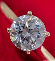 Close-up of round brilliant lab diamond in prong setting