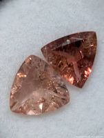 Close-up of both trilliant tourmalines showing color and inclusions