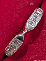 Top view showing channel-set baguette CZ stones in silver band