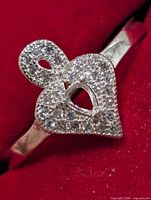 Top view of silver ring showing pavé CZ heart design