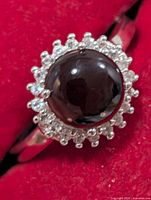 Front view of ring showing smoky quartz center and surrounding clear stones