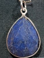 Front view of teardrop lapis lazuli pendant in silver bezel