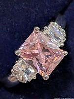 Front view showing pink rectangular center CZ and clear side stones