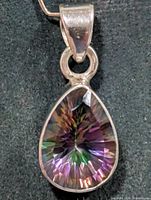 Front view of teardrop mystic topaz pendant in silver
