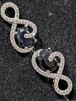 Front view showing sapphire and CZ arrangement on both earrings