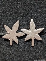Front view of both silver leaf stud earrings
