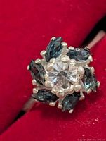 Top view showing clear central stone and surrounding blue marquise stones