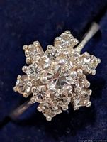 Top view of floral cluster ring showing clear stones