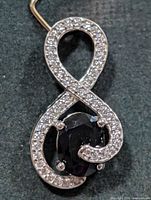 Front view showing sapphire and CZ detailing