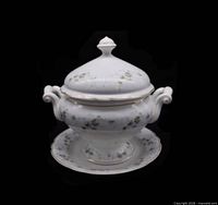 Lidded tureen on underplate showing overall form and matching pattern