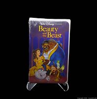 Front view of sealed Beauty and the Beast Black Diamond VHS on stand