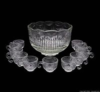 Punch bowl with 11 cups displayed together
