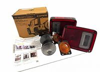 Boxed XPrite tail lights with two red tail light units, round clear turn signal lights, amber side marker, instructions