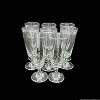 Group shot of all eight clear pedestal glasses