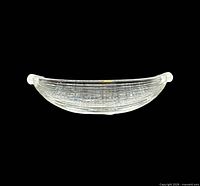 Side profile of clear ribbed crystal oval bowl