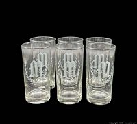Front view of all six etched monogram M glasses