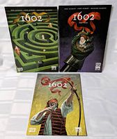 Three Marvel 1602 comic books laid out: Parts 2-4