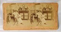 Front view of entire stereoview card with twin images and caption