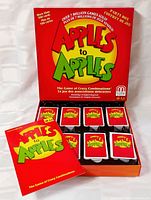 Open game box showing card decks and booklet