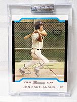 Front view of Jon Coutlangus Bowman First Year baseball card in plastic holder