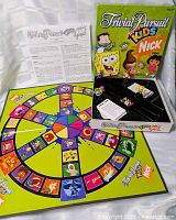 Box, open, showing lid art, game board, instruction sheet and tray with pieces