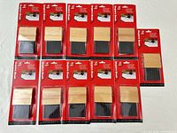 Front view showing 11 packaged Schutt umpire brushes