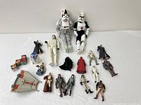 Group shot of all action figures, vehicle wing and cube accessories