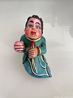 Front view of hand-painted papier-mâché figure