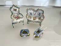 Front view showing all four porcelain miniatures