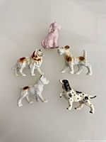 All five ceramic dog figurines grouped