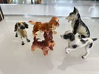 All five ceramic dog figurines displayed