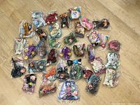 Full lot of sealed McDonald’s Ty Teenie Beanie Babies spread on floor