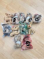 Group of 11 Taco Bell Chihuahua plush toys, mix of sealed and loose