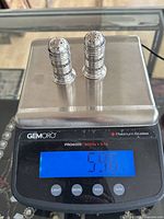 Both shakers on digital scale displaying 59.6 g