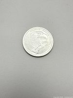 Obverse of round showing eagle and Strength Freedom Pride legend