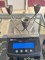 Candle holder on scale reading 307 g gross weight