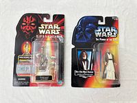 Both Star Wars action figures in original packaging side by side